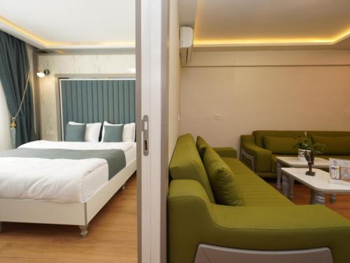 a hotel room with a bed and a couch at gazelle suites in Istanbul