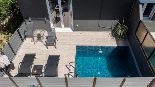 an overhead view of a swimming pool in a house at 7thHeaven Luxury aprts in Chania Town
