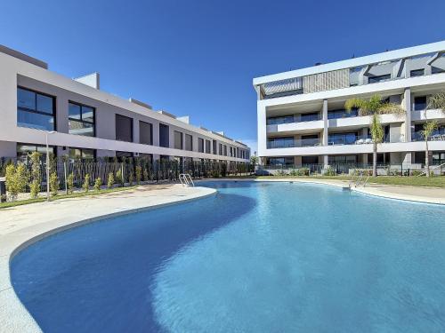 a large swimming pool in front of a building at MADRESELVA 62.29 in Torre-Pacheco