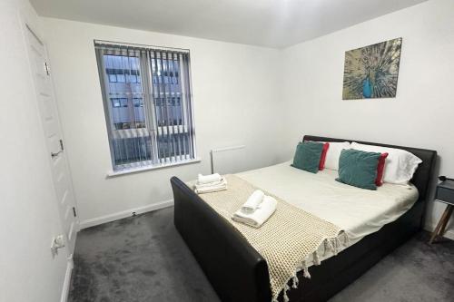 a bedroom with a bed in a white room at 4 Bed complete Home in Edinburgh Near Airport in Edinburgh