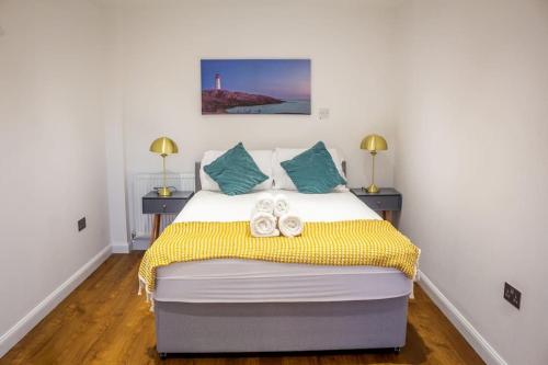 a bedroom with a bed with shoes on it at 4 Bed complete Home in Edinburgh Near Airport in Edinburgh