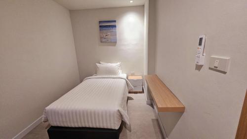 Un ou plusieurs lits dans un hébergement de l'établissement ARENICE Boutique Hotel
