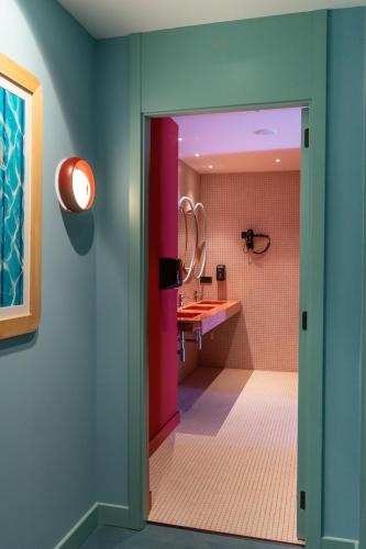 a bathroom with a sink and a mirror at The Boc Hostels - Beach in Can Pastilla