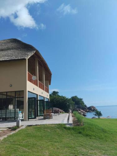 a building with a view of the ocean at Joma Adventure Lodge in Senga