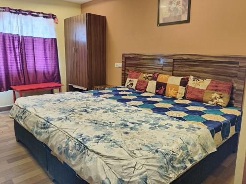 A bed or beds in a room at Sri Krishna Residency