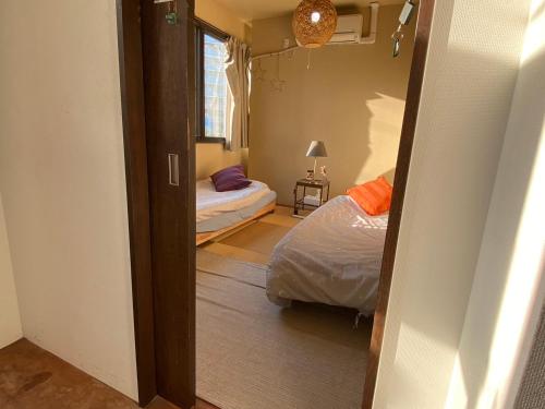 Ένα ή περισσότερα κρεβάτια σε δωμάτιο στο Bonfire Hostel Osaka