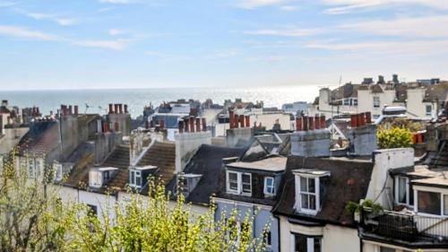 a view of a city with houses and the ocean at INNit Bliss in Brighton & Hove