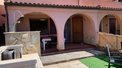 a house with arches and a patio at EdenRock2 in Riva dei Pini