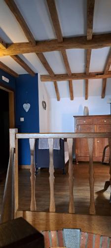 a wooden table in a room with a desk at Le Hourlay in Durbuy