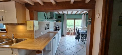 a kitchen with a sink and a counter top at Le Hourlay in Durbuy
