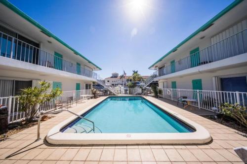 a swimming pool in front of a building at Mahalo Isles Apartments by Rocketstay in Fort Lauderdale