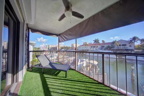 a balcony with a chair and a view of the ocean at Mahalo Isles Apartments by Rocketstay in Fort Lauderdale