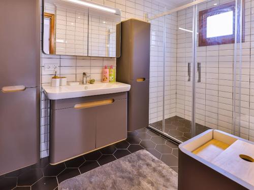a bathroom with a sink and a shower at Villa Sarpedon in Kaş