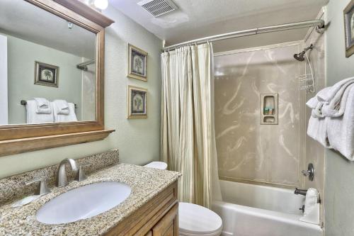 a bathroom with a sink and a shower and a toilet at Villa Madeira 404 - Premier in St. Pete Beach
