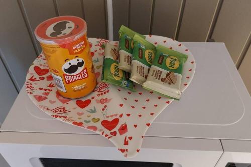 a table with a can of panda bear and a cake at Quiet and cozy cunuco guesthouse in Savaneta in Savaneta
