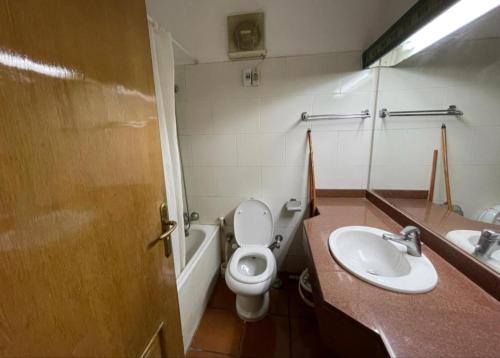 a bathroom with a toilet and a sink at Palmera El Sokhna Chalets Families Only in Ain Sokhna