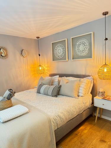 a bedroom with two beds and two lamps at Windsor Royal Retreat 2 bed 2 bath & private terrace in Windsor