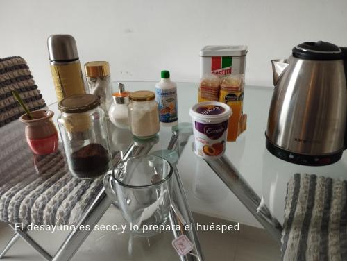 a table with a counter top with various ingredients at Hermoso Apartamento a estrenar in Buenos Aires