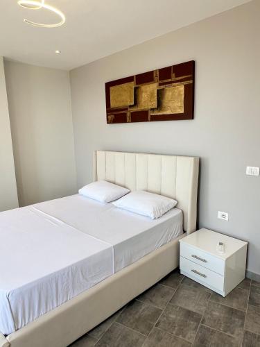 Ένα ή περισσότερα κρεβάτια σε δωμάτιο στο Sea View Apartments