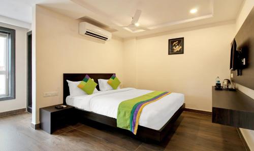 a bedroom with a large bed in a room at Treebo Excella in Visakhapatnam