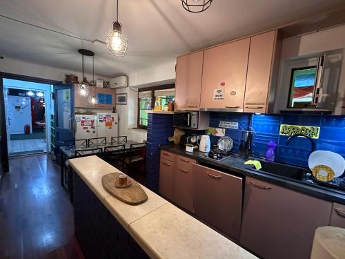 a kitchen with a counter and a counter top at Hostel Balkan Han in Sarajevo