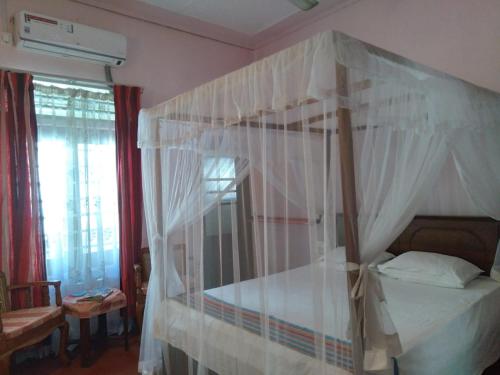Cama o camas de una habitación en Sujatha Villa Paradise