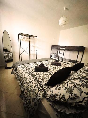 a bedroom with a bed and a surfboard in it at Dimora Nuscana in Nusco