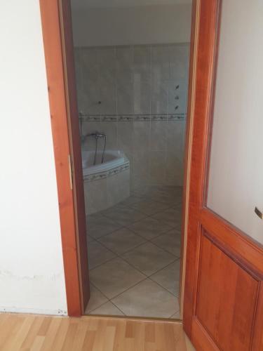 a bathroom with a shower and a bath tub at MATUS in Hrabušice
