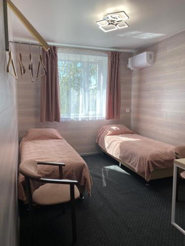 Postel nebo postele na pokoji v ubytování Hotel TETRIS Voznesensk
