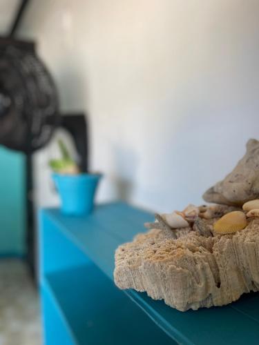 a blue counter top with a blue table with a sandwich at Palenque Beach House in San Onofre