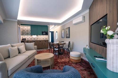 a living room with a couch and a table at Boulevard Boutique Suites in Łeba