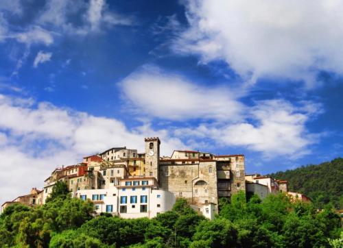 a large building on top of a hill at La Casa nel Borgo in Ameglia
