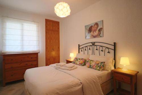 Ένα ή περισσότερα κρεβάτια σε δωμάτιο στο Apartamento Los Enebros