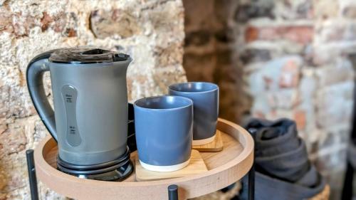 a tray with three cups and a blender on it at INNit Bliss in Brighton & Hove