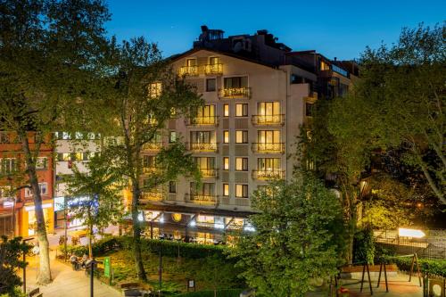 a hotel in the city at night at Nardi Nişantaşı in Istanbul