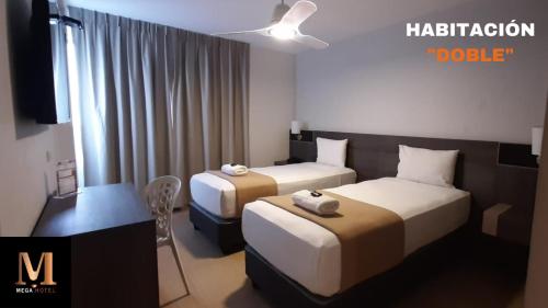 a hotel room with two beds and a table at Hotel Mega in Lima