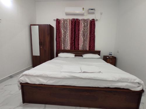 Ένα ή περισσότερα κρεβάτια σε δωμάτιο στο Sai Beach Stays