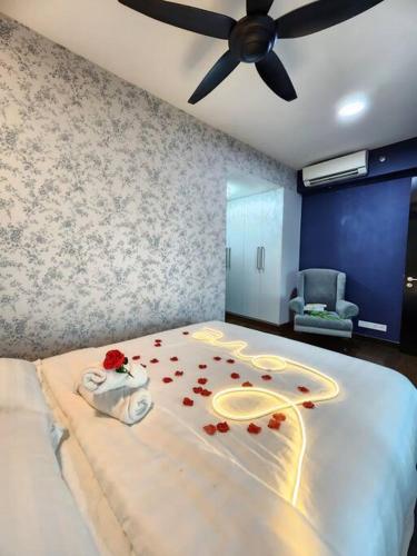 a bedroom with a bed with red roses on it at 2-6Pax Luxury Almas Duplex Suite Legoland near JB & Tuas in Nusajaya