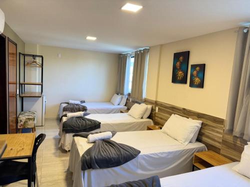 Кровать или кровати в номере Pousada Elo Inn