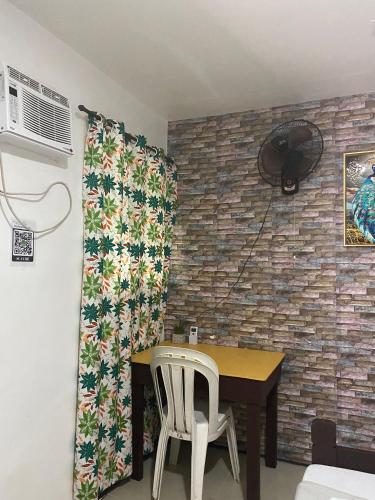 a dining room with a table and two chairs at Dreamland budget room in El Nido