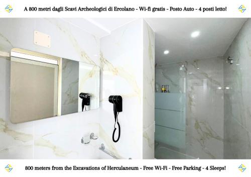 a bathroom with a shower and a phone on the wall at ERCOLANO SCAVI - Casa privata con wi-fi e posto auto a 10 minuti dagli scavi archeologici in Ercolano
