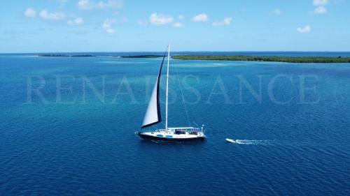 an aerial view of a sail boat in the water at 73ft Family Sailing Yacht with Crew - all inclusive in Waisalatupo