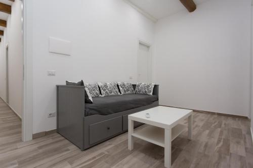 a living room with a couch and a table at Navona 68 in Rome