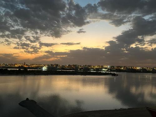a large body of water with a city in the background at منتجع اووه يامال البحري في الخيران OOh Yaa Mal in Al Khīrān