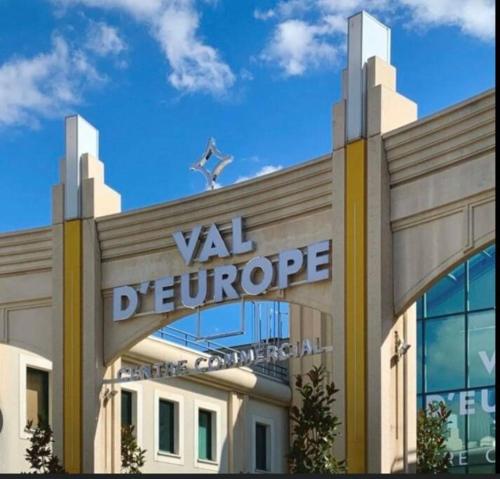 a building with a vla denver sign on it at Suite Familiale - 15 min Disney in Bussy-Saint-Georges