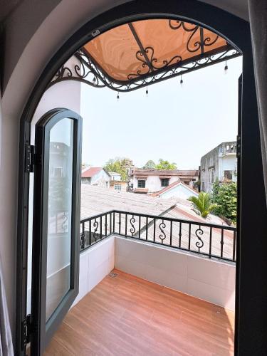 a balcony with a view of a city at Moon Homestay in Thôn Kim Long (1)