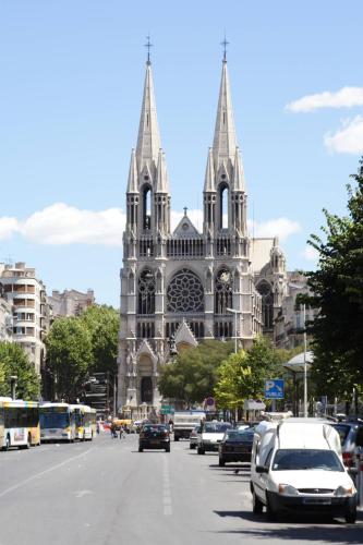 a cathedral with cars parked in front of it at Studio Tapisvert St Charles Canebière Vieux port in Marseille