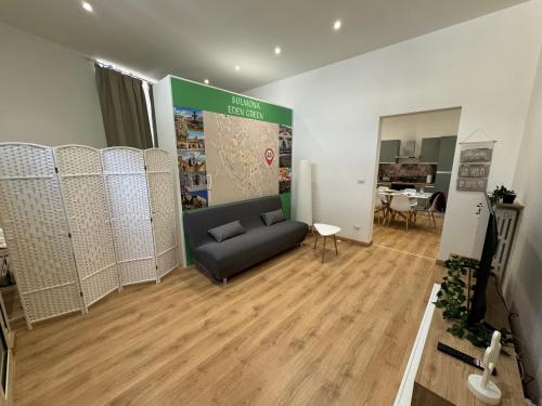 a living room with a couch and a table at Appartamento Eden Green in Sulmona