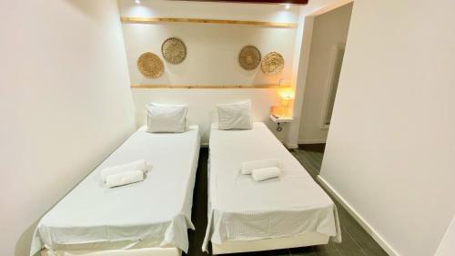Ένα ή περισσότερα κρεβάτια σε δωμάτιο στο Golden Stay Experience