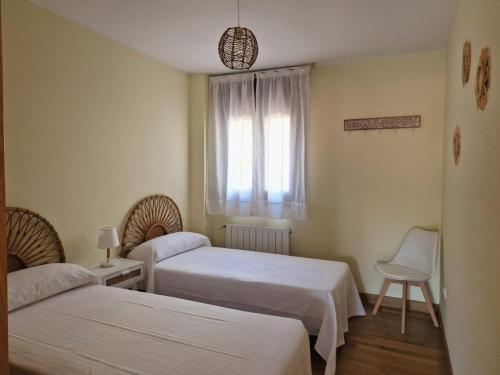 Giường trong phòng chung tại La CASUCA Del SABLE